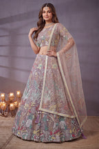 Dusty Rose engagement lehenga, close-up of the blouse and choli embroidery detailing, featuring thread and sequins embroidery work on net fabric.