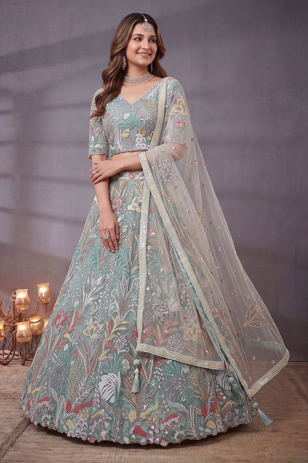 Sky Blue sequin lehenga, close-up of the lehenga skirt embroidery and sequin work, featuring thread and sequins embroidery work on net fabric.