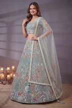 Sky Blue lehenga for diwali, detail view of the thread and sequins embroidery on net fabric, featuring thread and sequins embroidery work on net fabric.