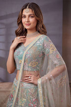 Sky Blue sequin lehenga, shown with the matching net dupatta draped, featuring thread and sequins embroidery work on net fabric.