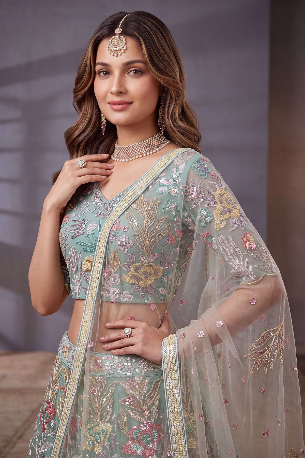 Sky Blue sequin lehenga, shown with the matching net dupatta draped, featuring thread and sequins embroidery work on net fabric.