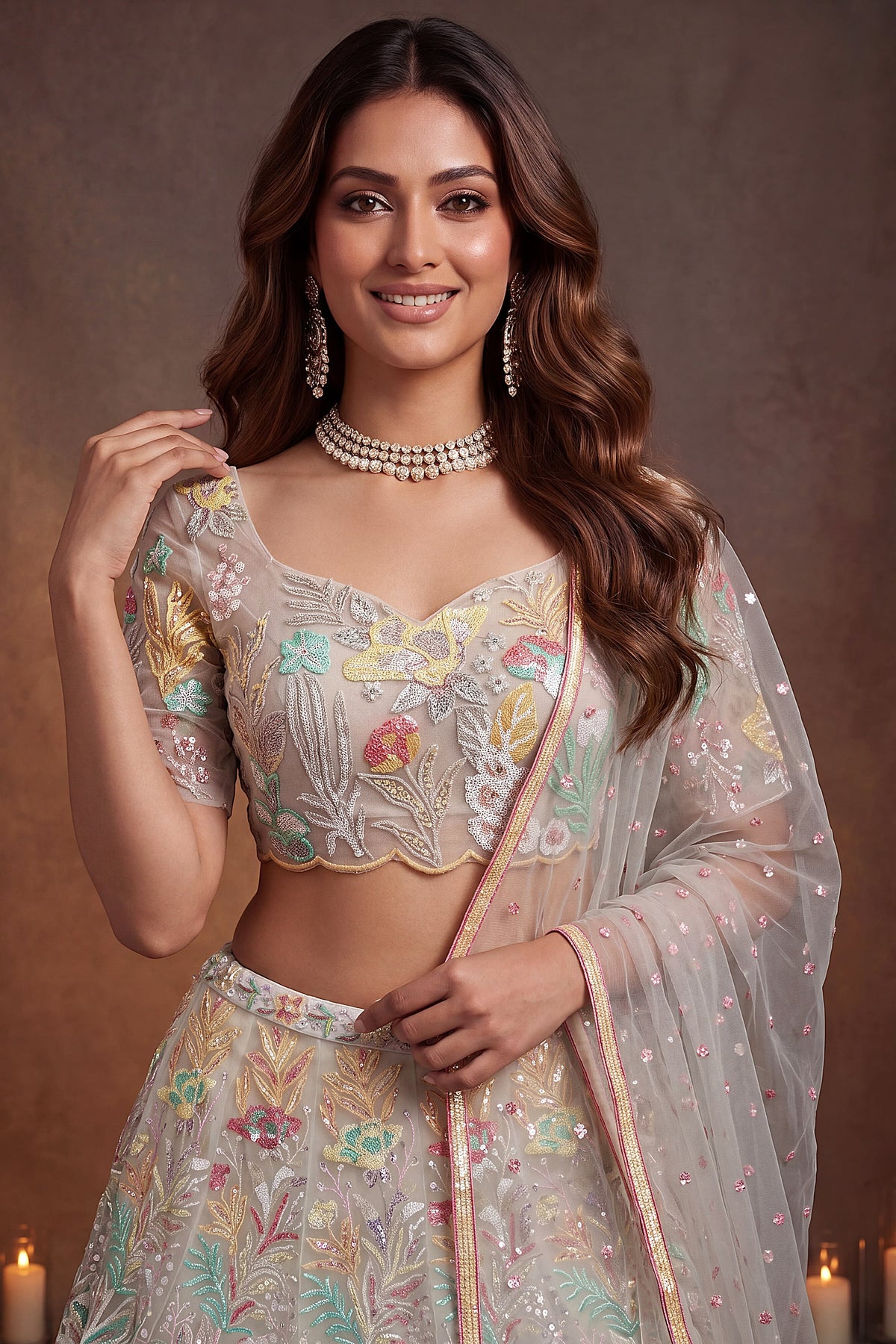 Beige Cream engagement lehenga, close-up of the blouse and choli embroidery detailing, featuring thread and sequins embroidery work on net fabric.