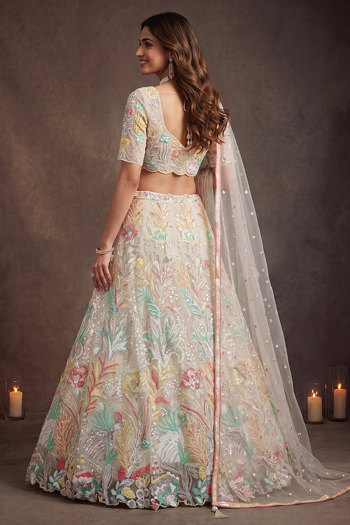Beige Cream lehenga for diwali, shown from the back view displaying the backside embroidery work, featuring thread and sequins embroidery work on net fabric.