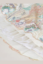 Beige Cream lehenga for diwali, close-up of the lehenga border and hem work, featuring thread and sequins embroidery work on net fabric.