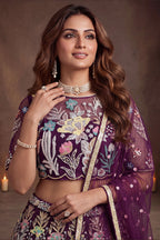 Wine Purple embroidered lehenga, close-up of the lehenga skirt embroidery and sequin work, featuring thread and sequins embroidery work on net fabric.