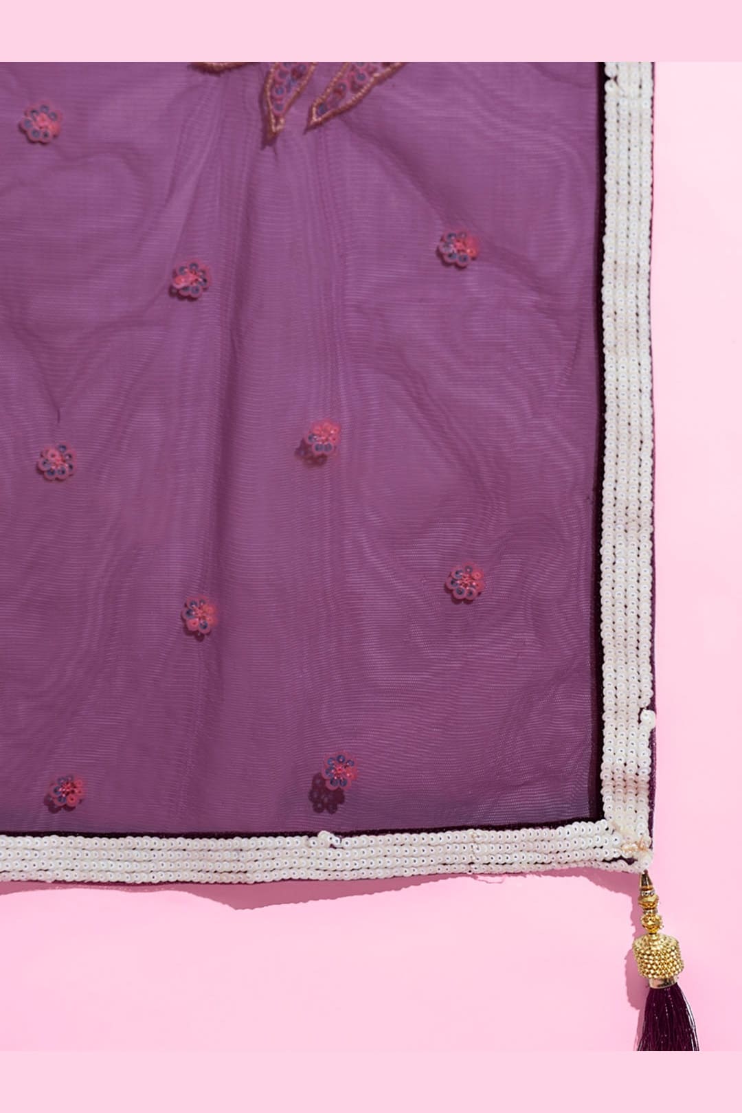 Wine Purple embroidered lehenga, close-up of the lehenga border and hem work, featuring thread and sequins embroidery work on net fabric.