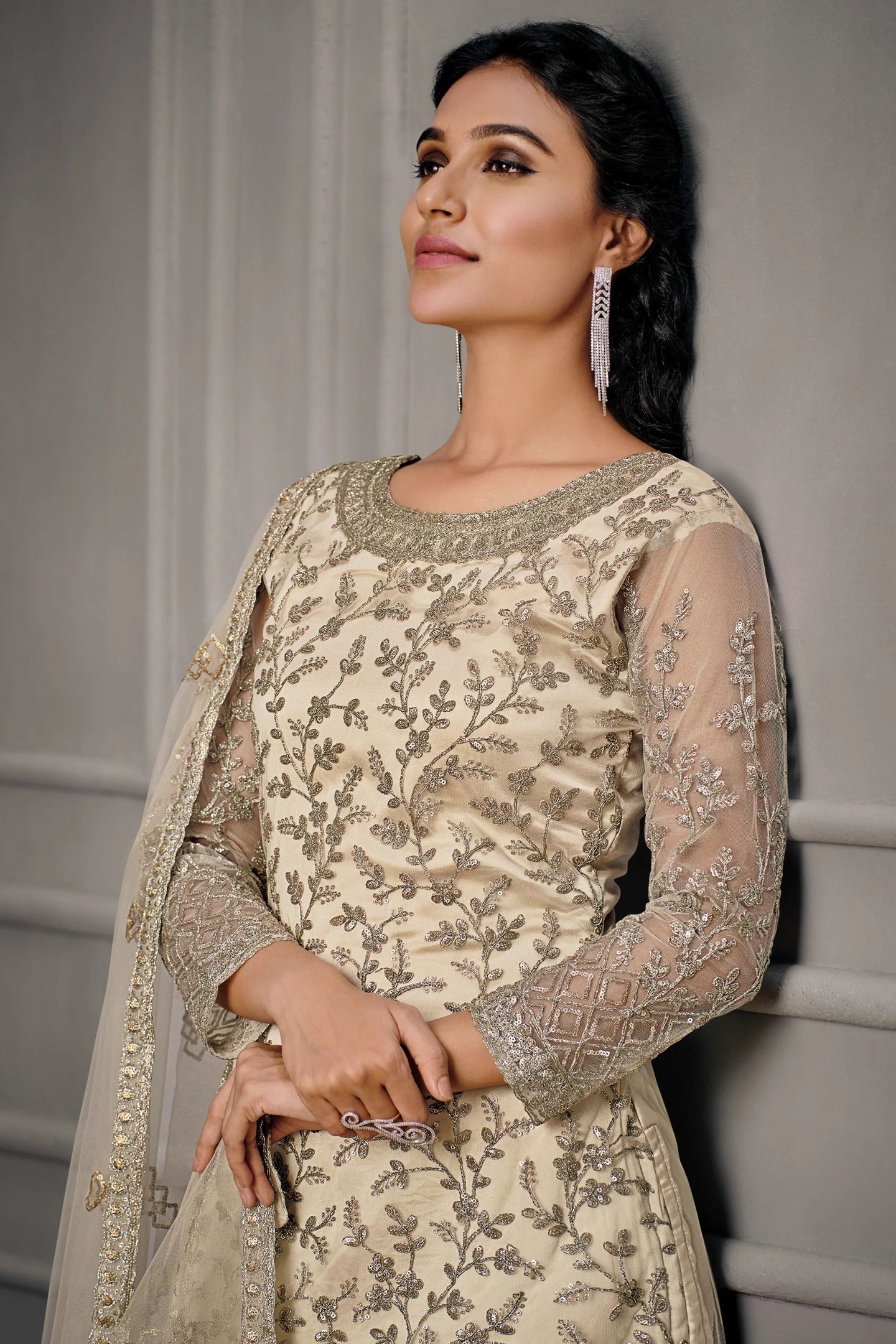 Cream net kameez suit closup view showing embroidery work and net dupatta