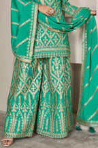 Green Chinon Silk Plazo Suit For Indian Weddings & Pakitani Festival - Embroidery Work, Mirror Work - hem and footwear detail