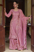Model wearing a light pink ladies palazzo suit with embroidered simmer silk kurta and scalloped dupatta, shown in full length.