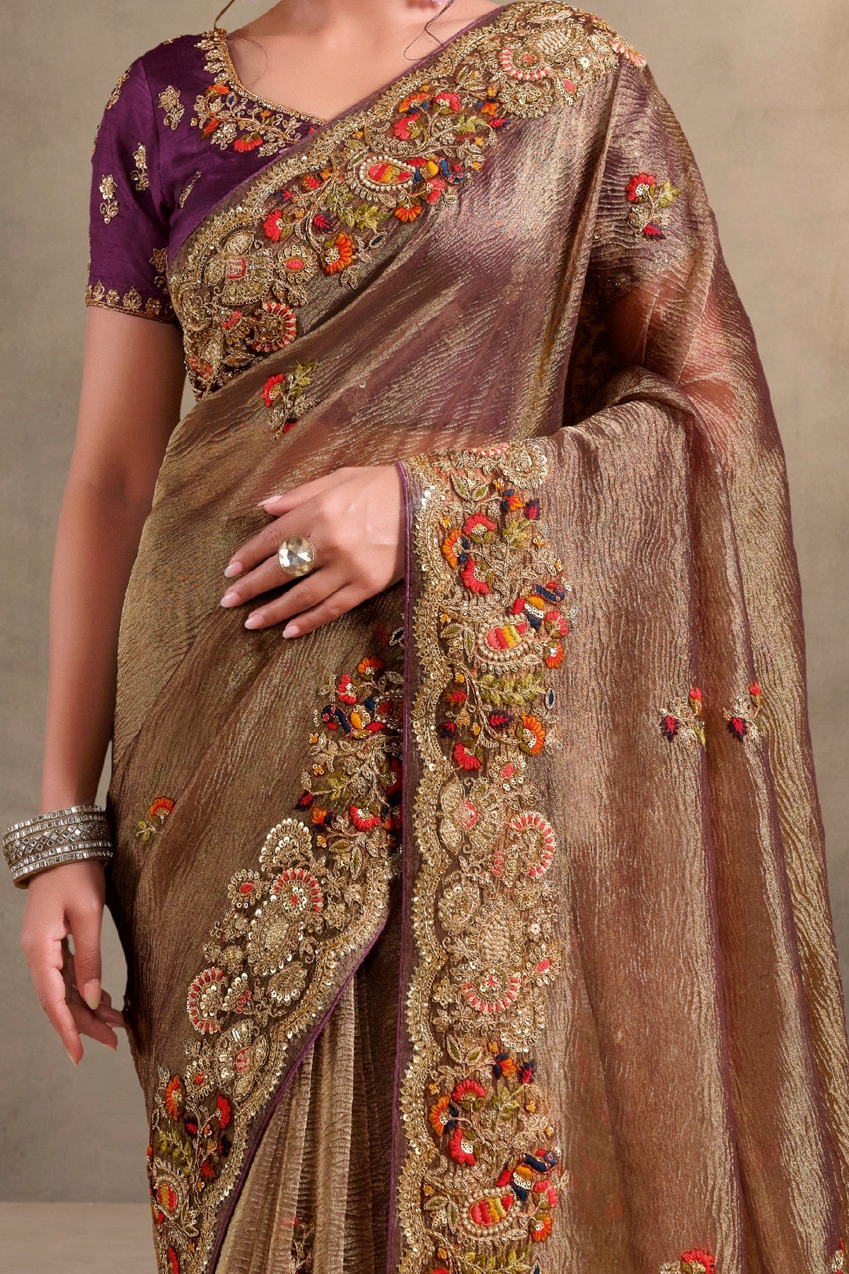Brown saree for wedding with khatli and sequin embroidery, upper-body closeup of the embroidery and handwork detailing