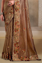 Brown embroidered saree with khatli and sequin embroidery, waist-down view of the pleats and flowing saree drape