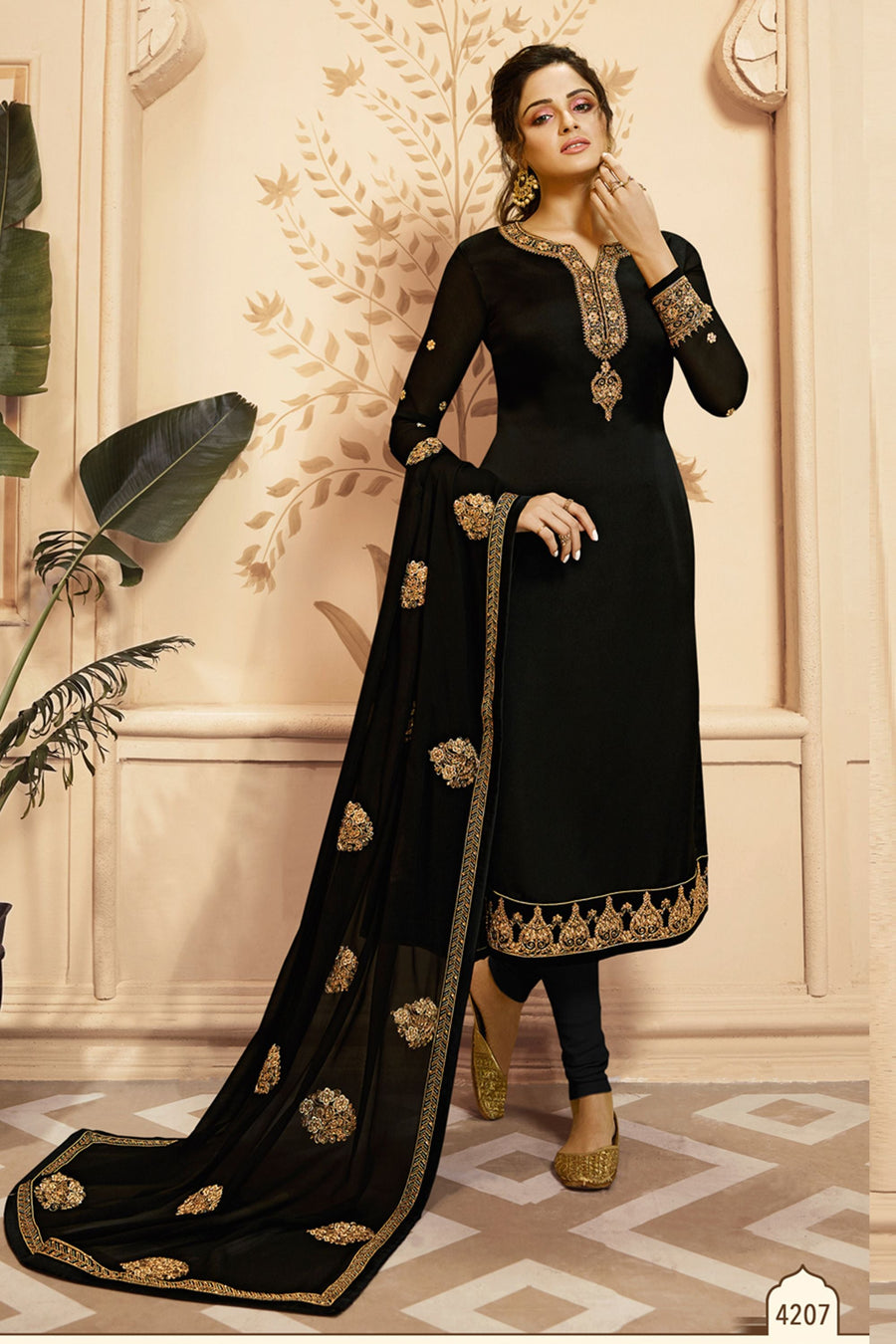 An Indian women wearing a black salwar kameez suits with Churidar & dupatta for Indian Wedding Outfits featuring embroidery work.