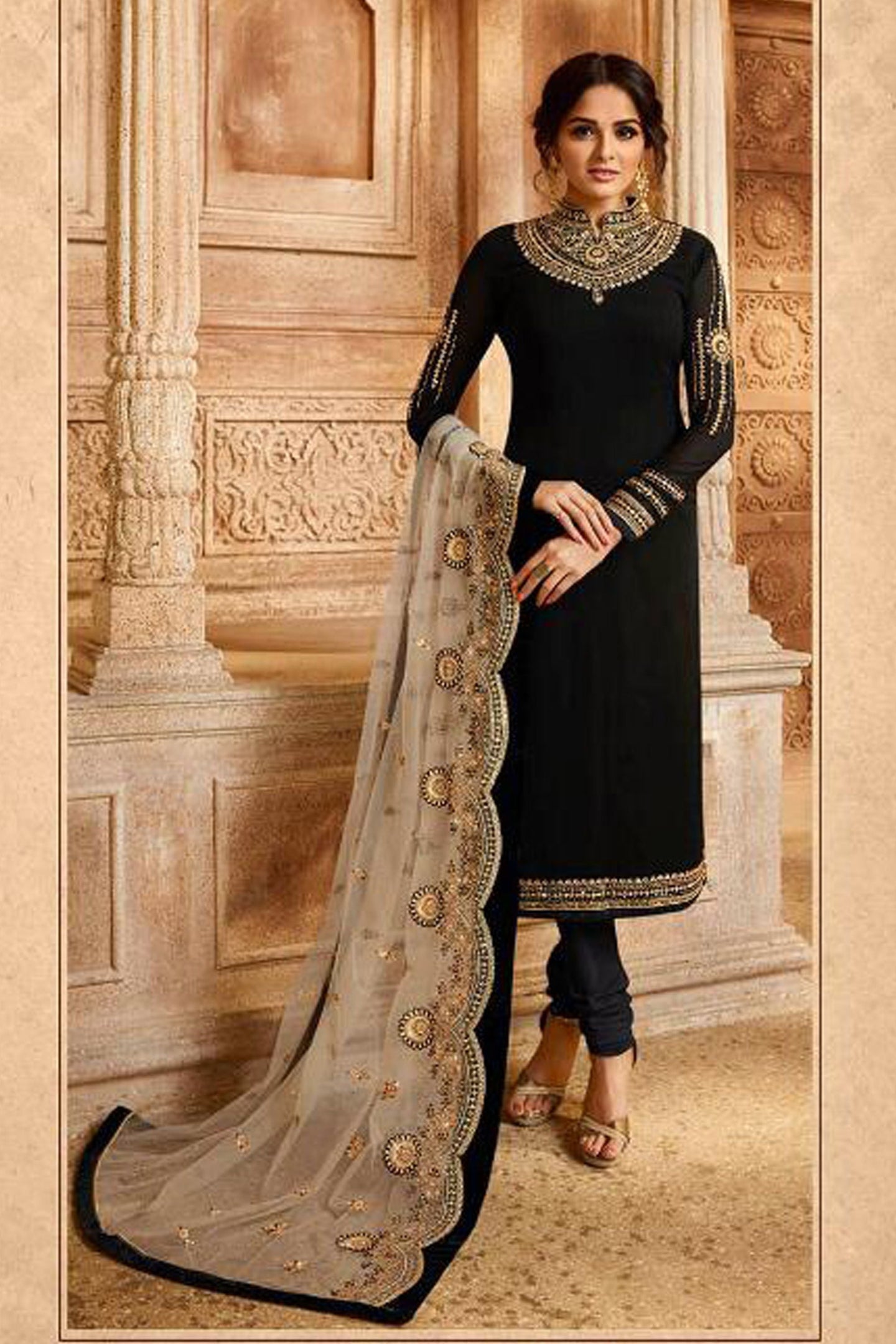 A indian wedding clothes for guests in a shalwar kameez female with chuddidar, featuring embroidery work, along with a dupatta.